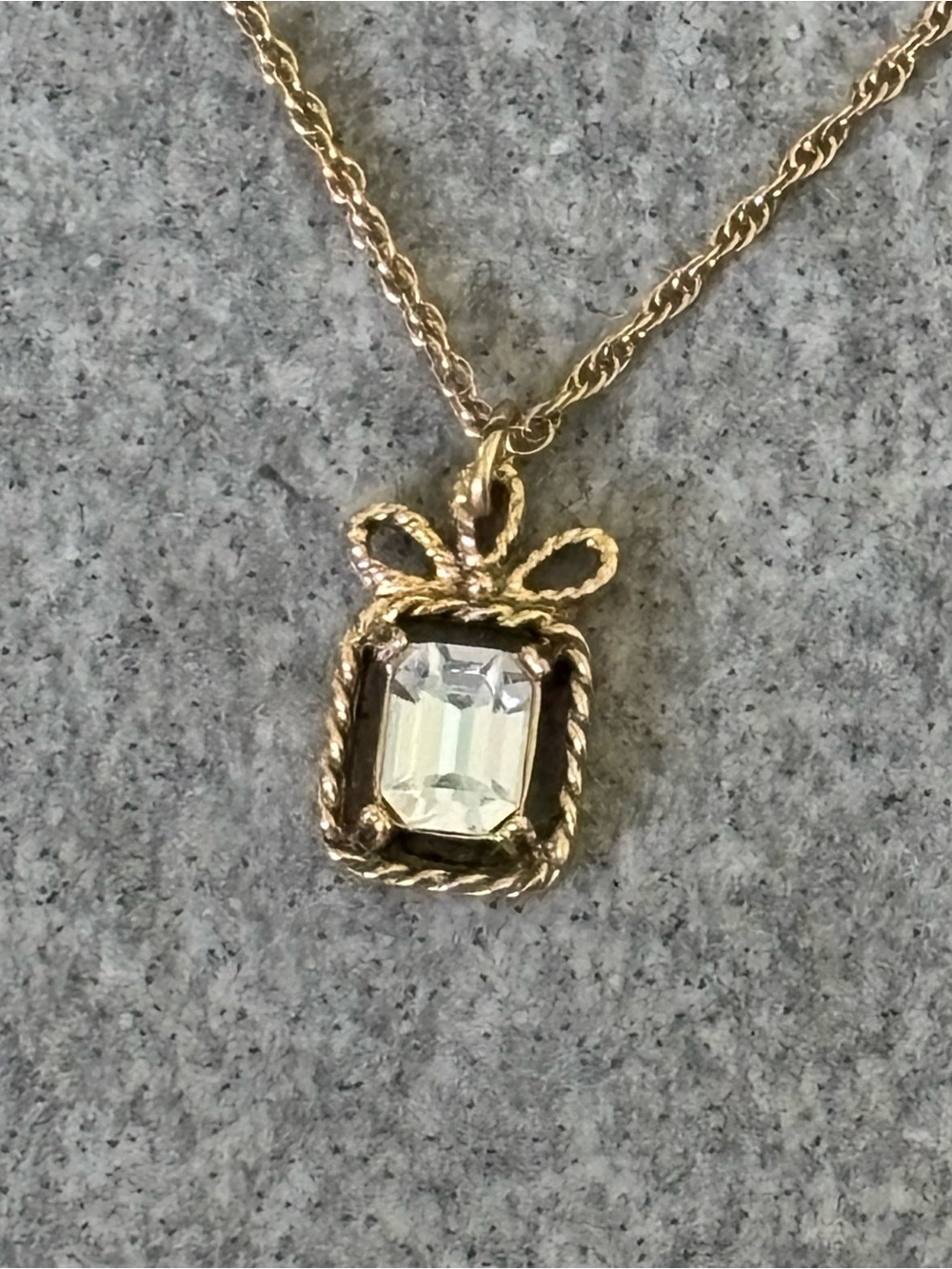 Vintage, 1928 Brand, Goldtone Bow Pendant Necklace with Clear Emerald-Cut Stone